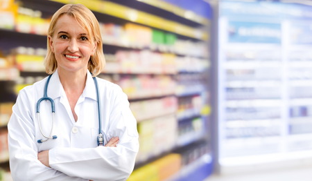 Senior woman pharmacist working in the pharmacy. Medical healthcare and medicine service.の写真素材