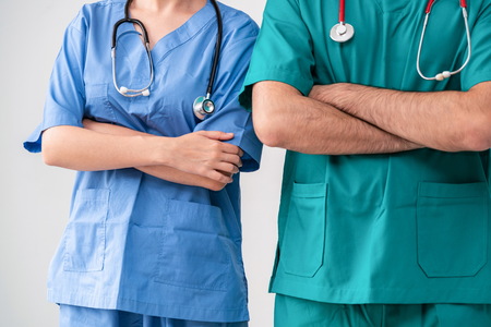 Healthcare people group. Professional doctor working in hospital office or clinic with other doctors, nurse and surgeon. Medical technology research institute and doctor staff service concept.の写真素材