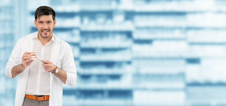 Young male dentist working in dental clinic. Dentistry care and medical service concept.の写真素材