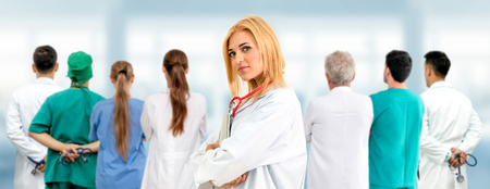 Healthcare people group. Professional doctor working in hospital office or clinic with other doctors, nurse and surgeon. Medical technology research institute and doctor staff service concept.の写真素材