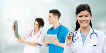 Healthcare people group. Professional doctor working in hospital office or clinic with other doctors, nurse and surgeon. Medical technology research institute and doctor staff service concept.の写真素材