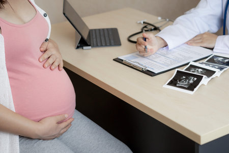 Happy pregnant woman visit gynecologist doctor at hospital or medical clinic for pregnancy...