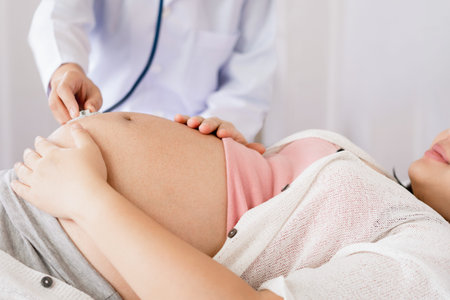 Happy pregnant woman visit gynecologist doctor at hospital or medical clinic for pregnancy...