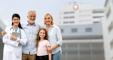 Doctor with happy family of mother, father and daughter at the hospital. Medical healthcare and doctor service.の写真素材