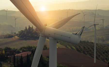 Wind turbine farm power generator in beautiful nature landscape for production of renewable green...
