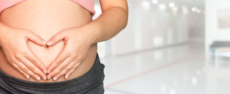 Pregnant woman at hospital health check up. Gynecology heath care concept.