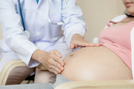 Happy pregnant woman visit gynecologist doctor at hospital or medical clinic for pregnancy...