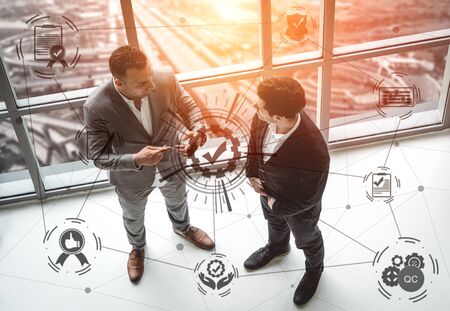 Quality Assurance and Quality Control Concept - Modern graphic interface showing certified standard process, product warranty and quality improvement technology for satisfaction of customer.の写真素材