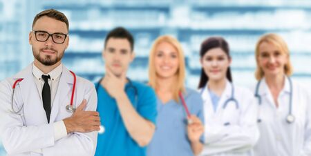 Healthcare people group. Professional doctor working in hospital office or clinic with other doctors, nurse and surgeon. Medical technology research institute and doctor staff service concept.の写真素材