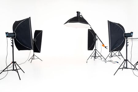 Professional studio lighting soft boxes set up ready for photo shoot session.の写真素材