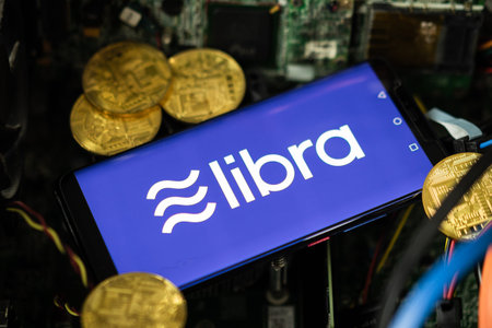 Bangkok, Thailand - July 2, 2019: Phone shows Libra logo on the screen. Facebook reported to utilize new cryptocurrency called Libra. Libra was reported to be used for purchases in Facebook and other.のeditorial素材