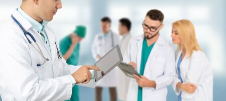 Healthcare people group. Professional doctor working in hospital office or clinic with other doctors, nurse and surgeon. Medical technology research institute and doctor staff service concept.の写真素材