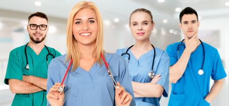 Healthcare people group. Professional doctor working in hospital office or clinic with other doctors, nurse and surgeon. Medical technology research institute and doctor staff service concept.の写真素材
