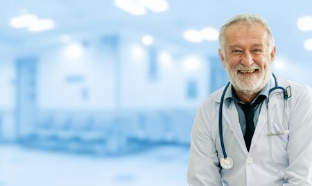 Senior male doctor working at the hospital. Medical healthcare and doctor staff service.の写真素材