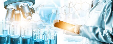 Research and development concept. Double exposure image of scientific and medical lab instrument, microscope, test tube and glass flask for microbiology and chemistry in laboratory for medicine study.の写真素材