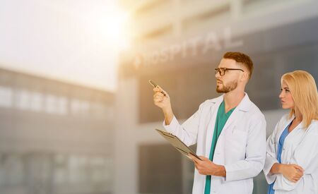 Doctor working with another doctor in the hospital. Healthcare and medical service.の写真素材