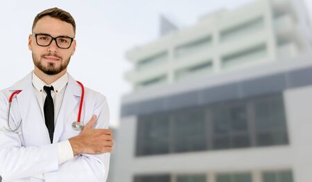 Young male doctor working at the hospital. Medical healthcare and doctor staff service.の写真素材