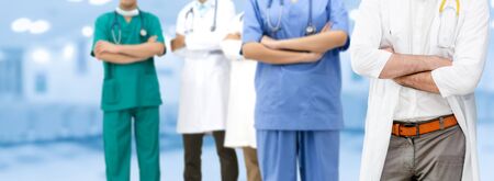 Healthcare people group. Professional doctor working in hospital office or clinic with other doctors, nurse and surgeon. Medical technology research institute and doctor staff service concept.の写真素材