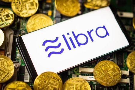 Bangkok, Thailand - July 2, 2019: Phone shows Libra logo on the screen. Facebook reported to utilize new cryptocurrency called Libra. Libra was reported to be used for purchases in Facebook and other.のeditorial素材