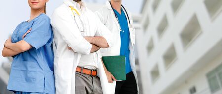 Healthcare people group. Professional doctor working in hospital office or clinic with other doctors, nurse and surgeon. Medical technology research institute and doctor staff service concept.の写真素材