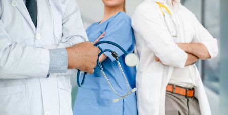 Healthcare people group. Professional doctor working in hospital office or clinic with other doctors, nurse and surgeon. Medical technology research institute and doctor staff service concept.の写真素材