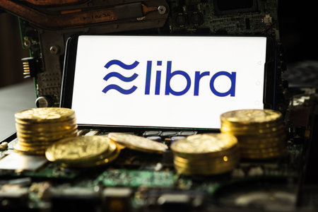 Bangkok, Thailand - July 2, 2019: Phone shows Libra logo on the screen. Facebook reported to utilize new cryptocurrency called Libra. Libra was reported to be used for purchases in Facebook and other.のeditorial素材
