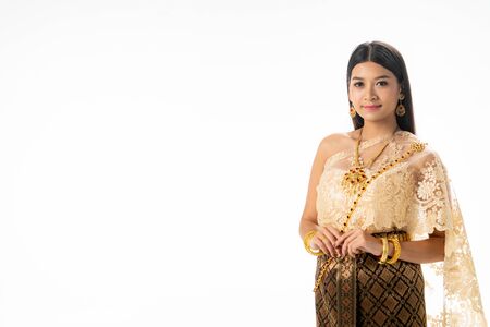 Beautiful Thai woman portrait dress up in traditional thai costume on white background. Thailand culture concept.の写真素材