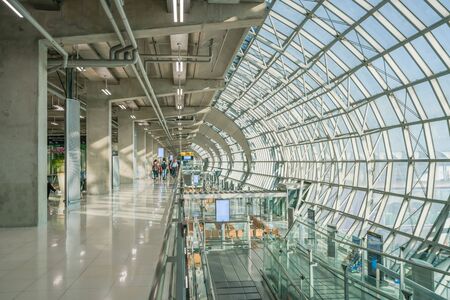 BANGKOK, THAILAND - DEC 11, 2018: Tourists walk in terminal of Suvarnabhumi Airport in Bangkok, Thailand. Suvarnabhumi Airport is one of two international airports serving Bangkok.のeditorial素材