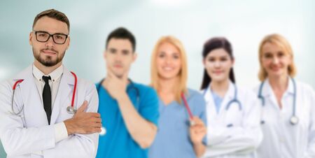 Healthcare people group. Professional doctor working in hospital office or clinic with other doctors, nurse and surgeon. Medical technology research institute and doctor staff service concept.の写真素材