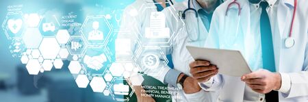 Health Insurance Concept - Doctor in hospital with health insurance related icon graphic interface showing healthcare people, money planning, risk management, medical treatment and coverage benefit.の写真素材