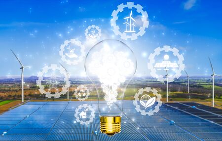 Green energy innovation light bulb with future industry of power generation icon graphic interface. Concept of sustainability development by alternative energy.の写真素材