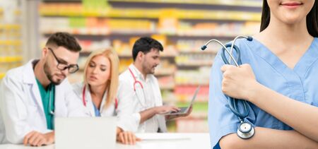 Healthcare people group. Professional doctor working in hospital office or clinic with other doctors, nurse and surgeon. Medical technology research institute and doctor staff service concept.の写真素材