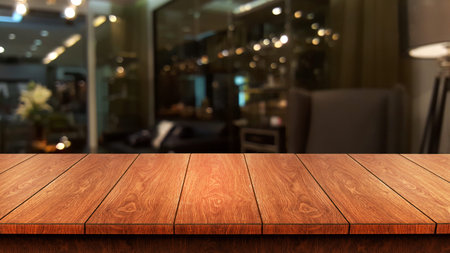 Wood table in blurry background of modern restaurant room or coffee shop with empty copy space on...