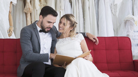 Happy bride and groom in wedding dress prepare for married in wedding ceremony. Romantic love of man and woman couple.の写真素材