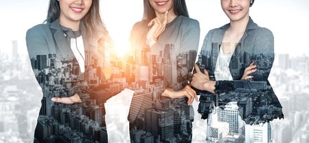 Double exposure image of many business people conference group meeting on city office building in background showing partnership success of business deal. Concept of teamwork, trust and agreement.の写真素材