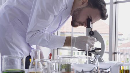 Scientist work with science equipment in laboratory. Scientific experiment and education for research development concept.の写真素材