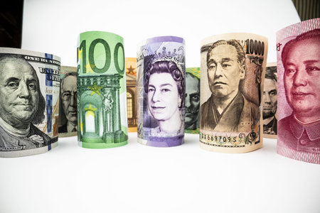 Macro shot of international currency money include US American Dollar, Euro Currency, British UK...
