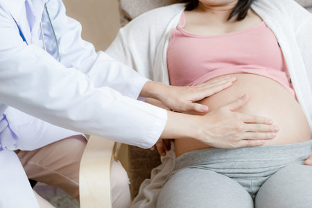 Happy pregnant woman visit gynecologist doctor at hospital or medical clinic for pregnancy...