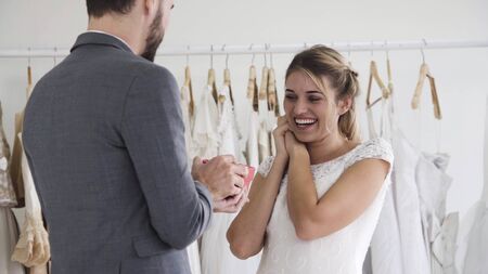 Happy bride and groom in wedding dress prepare for married in wedding ceremony. Romantic love of man and woman couple.の写真素材