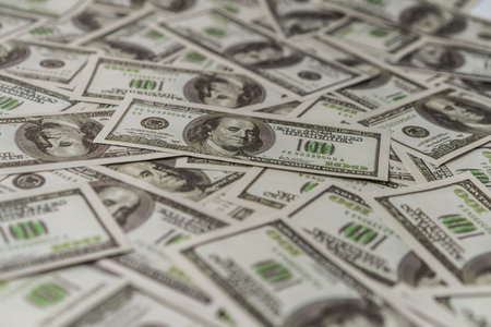Large money number of many American one hundred dollar paper banknote . Concept of money finance and...