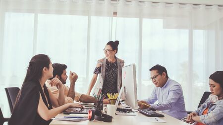 Successful business people group celebrating project success at office. Team winner and collaboration achievement concept.の写真素材