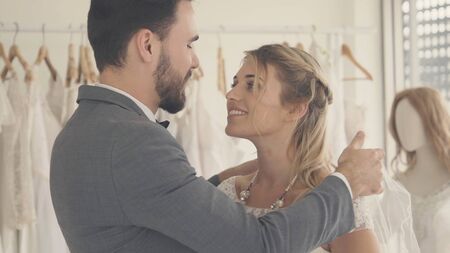 Happy bride and groom in wedding dress prepare for married in wedding ceremony. Romantic love of man and woman couple.の写真素材