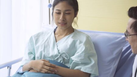 Doctor or physician take care of sick patient at the hospital or medical clinic. The happy patient visit doctor and discuss for illness cure treatment. Medical healthcare and doctor service concept.の写真素材