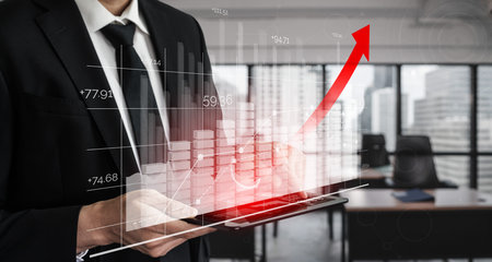 Double Exposure Image of Business and Finance - Businessman with report chart up forward to financial profit growth of stock market investment.の写真素材