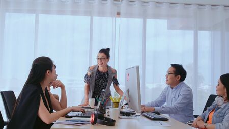 Successful business people group celebrating project success at office. Team winner and collaboration achievement concept.の写真素材