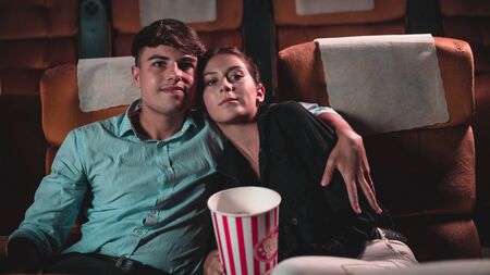 People audience watching movie in the movie theater cinema. Group recreation activity and entertainment concept.の写真素材