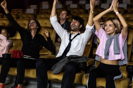 Audience is happy and exciting in movie theater cinema. Group recreation activity and entertainment concept.の写真素材
