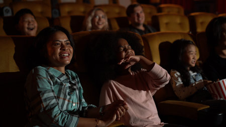 People audience watching movie in the movie theater cinema. Group recreation activity and entertainment concept.の写真素材