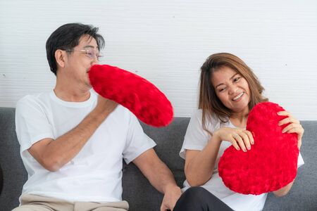 Happy Asian senior couple having good time at home. Old people retirement and healthy citizens elderly concept.の写真素材