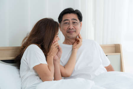 Happy Asian senior couple having good time at home. Old people retirement and healthy citizens elderly concept.の写真素材